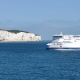 Car Ferry arriving at Dover UK with the wight cliffs of dover in the background