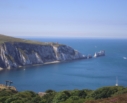 Isle of white needles which are big white rocks that point out of the sea. The picure is a sunny day so rare